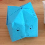 origami box in blue with eyes